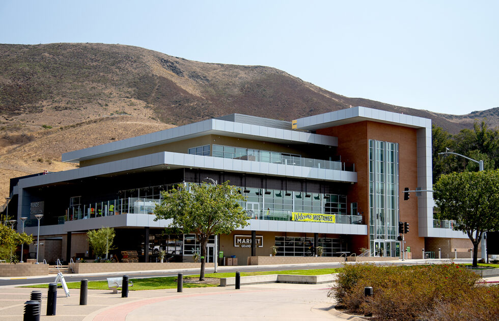 Exterior of Vista Grande Dining Complex at Cal Poly with modern architecture and hills in the background