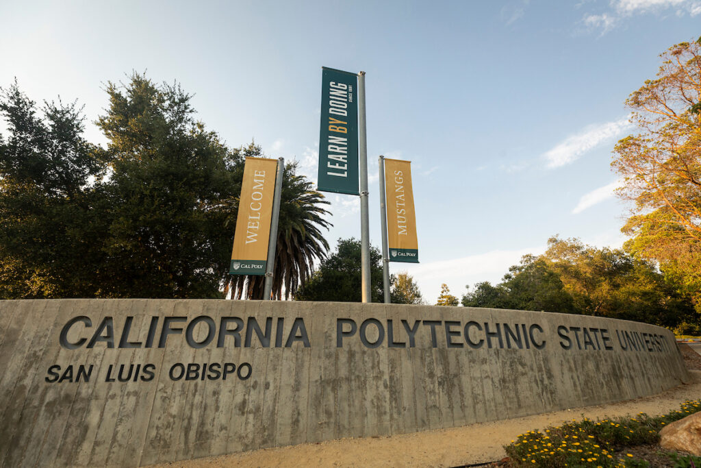 California Polytechnic State University entrance sign in San Luis Obispo with campus banners